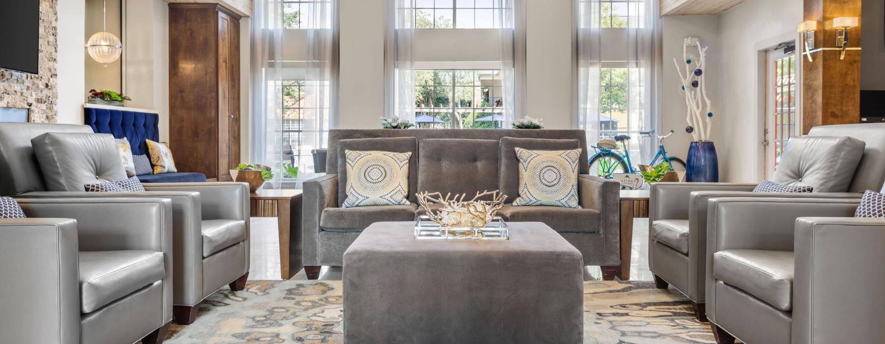lounge area with high ceilings and wooden accents