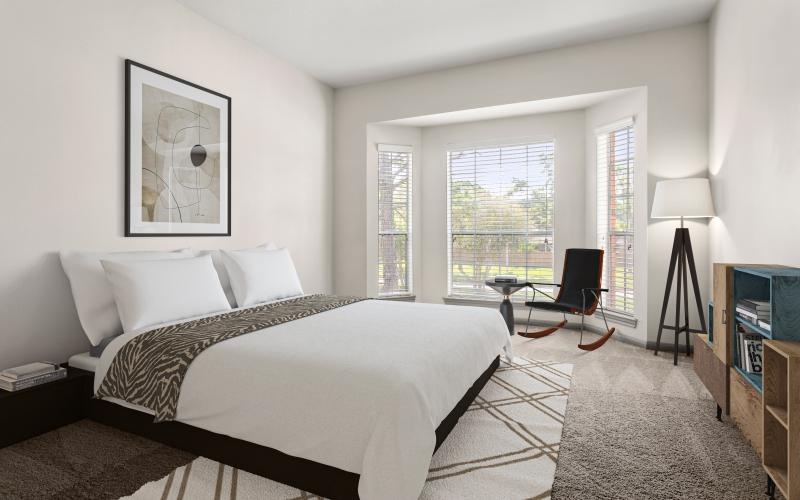 a bedroom with a bed and a chair