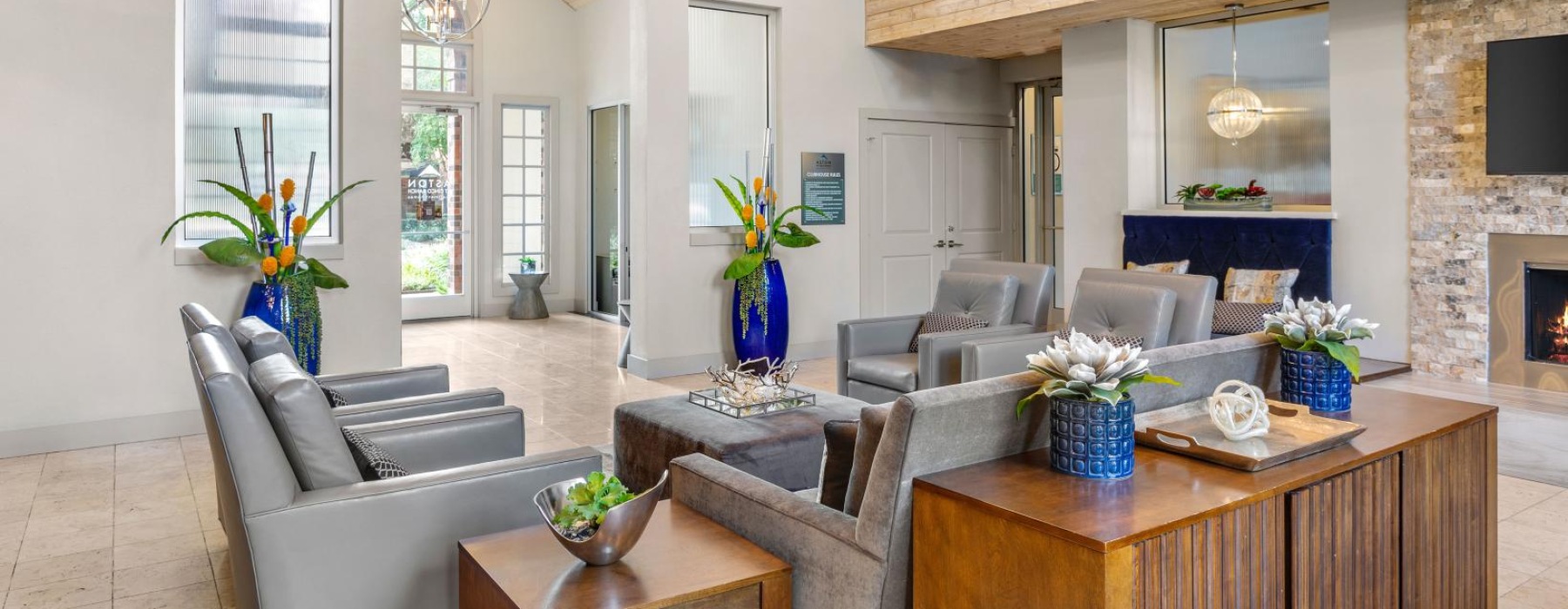 lounge area with high ceilings and wooden accents